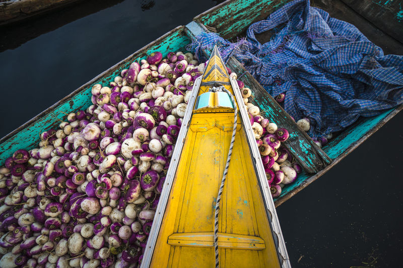 High angle view of vegetables in boat over lake