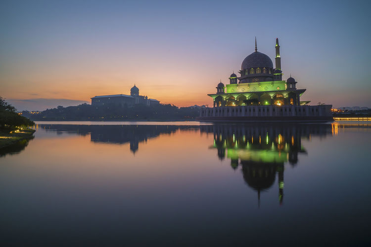 Sunrise at putrajaya mosque with perfect reflection