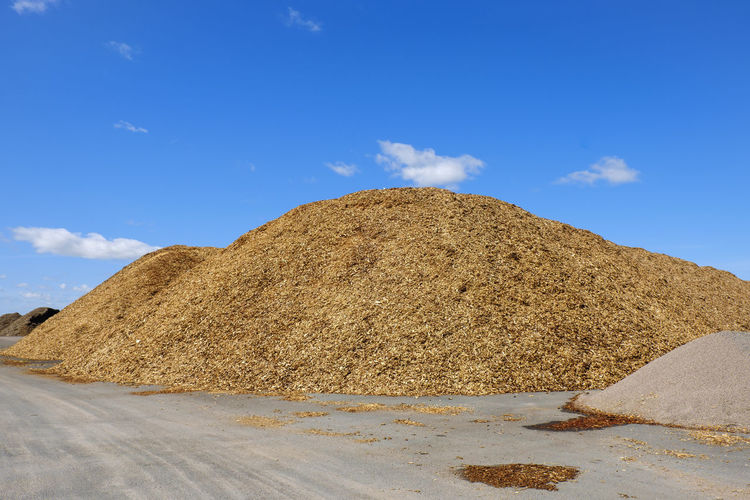 Wood chips piles on a big storage site