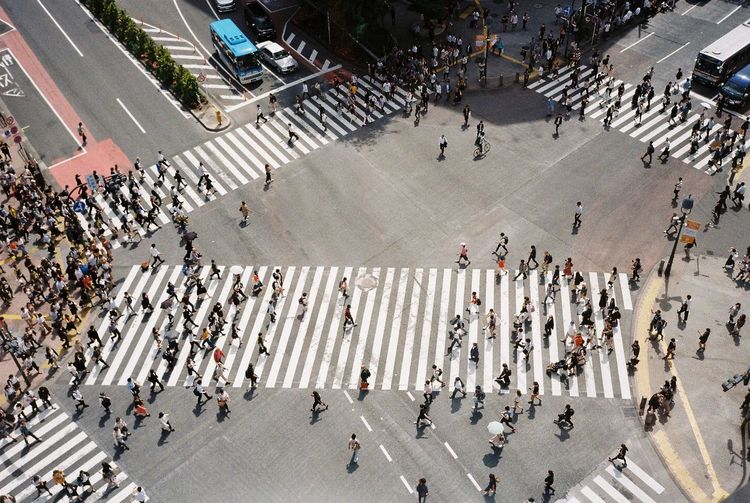 High angle view of people crossing road