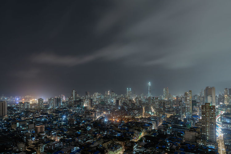 View of cityscape against sky at night