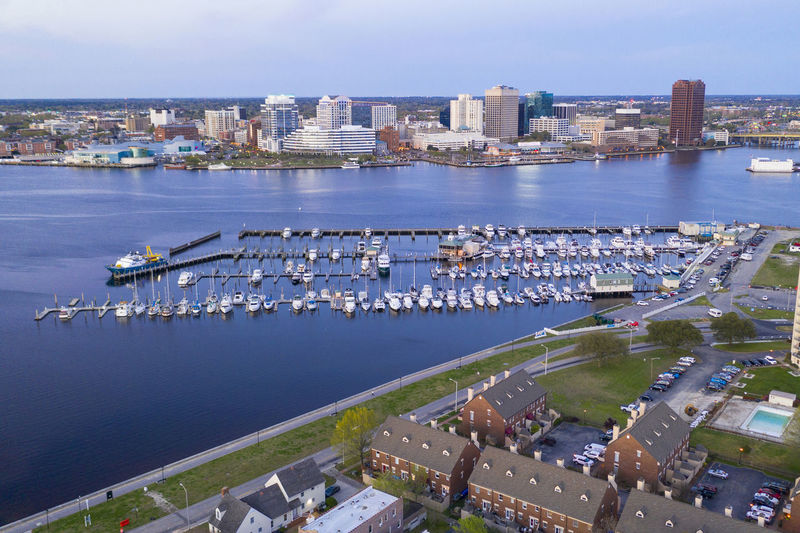 High angle view of harbor and buildings in city