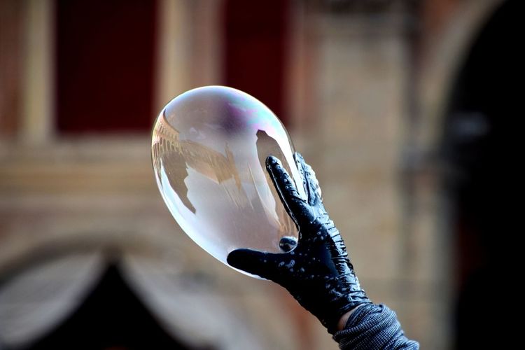 Close-up of hand holding bubble