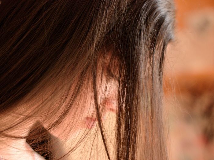 Close-up of girl with long brown hair