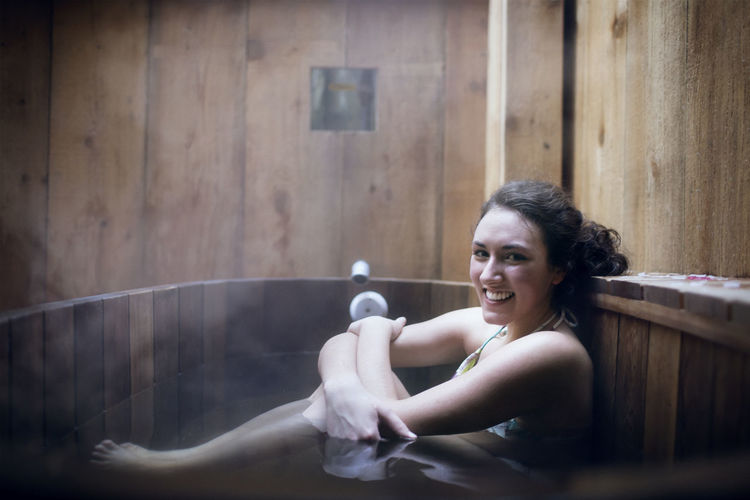 Young smiling woman at sauna