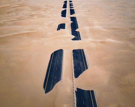 High angle view of two lane road in desert