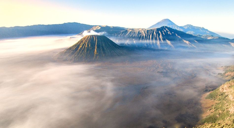 Aerial view of volcanic mountain against sky at mount bromo, java, indonesia. 