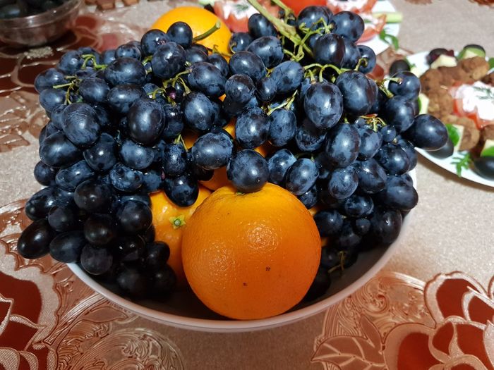 Close-up of grapes on table