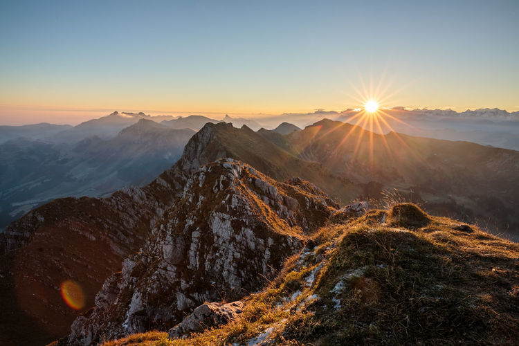 Scenic view of rocky mountains during sunset