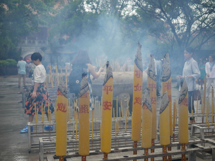 Close-up on incense sticks burning at temple