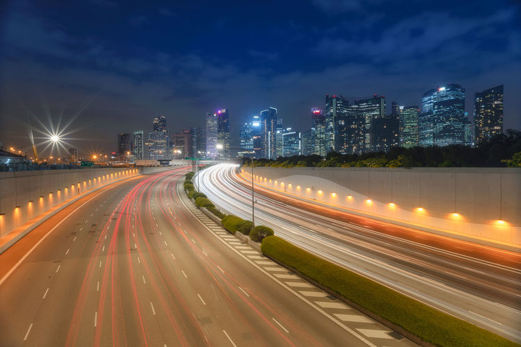 Singapore busy road and city with motion-blurred vehicle, car in singapore city highway.