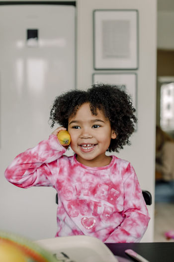 portrait of cute girl with balloons