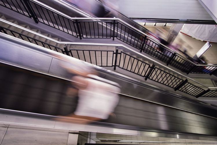 High angle view of people walking on staircase