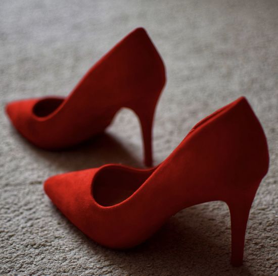 High angle view of red shoes on rug