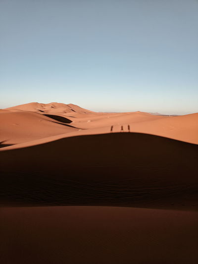 Scenic view of desert against clear sky