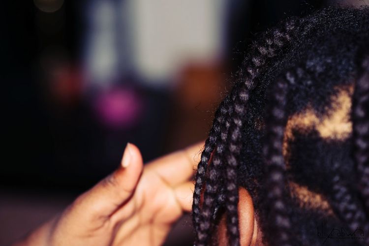 Cropped image of person with dreadlocks
