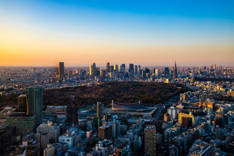 High angle view of city buildings during sunset