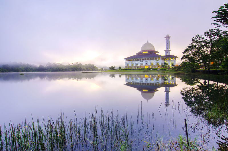 Scenic view of calm lake against sky