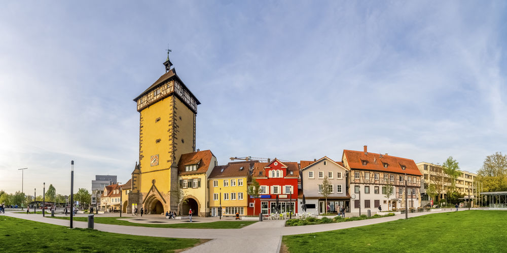 View of church and buildings against sky