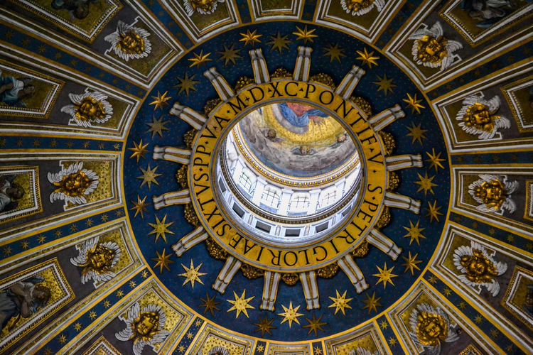 Directly below shot of ceiling of st. peter's basilica in rome