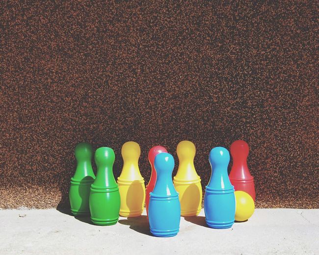 Close-up of multi colored plastic bowling pins