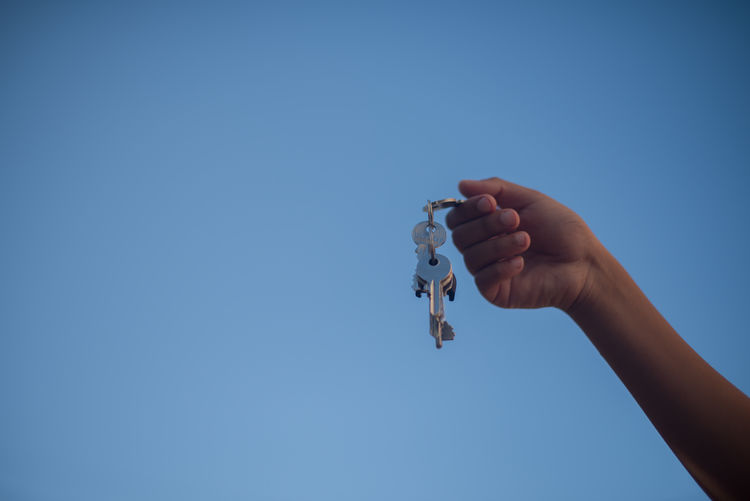 Close-up of hand holding keys
