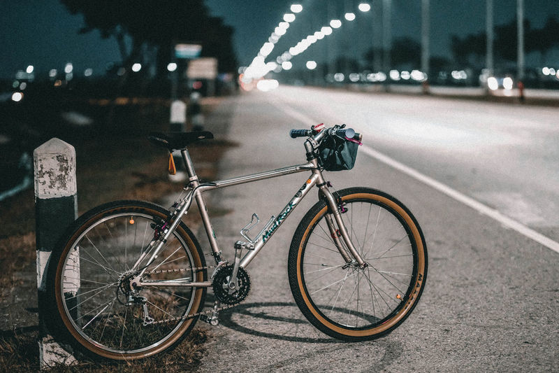 Side view of bicycle parked on road