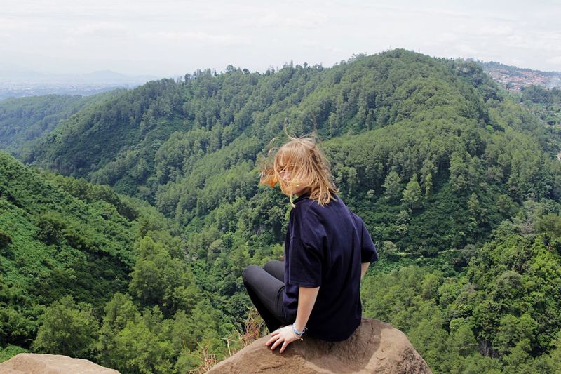 Woman sitting on landscape