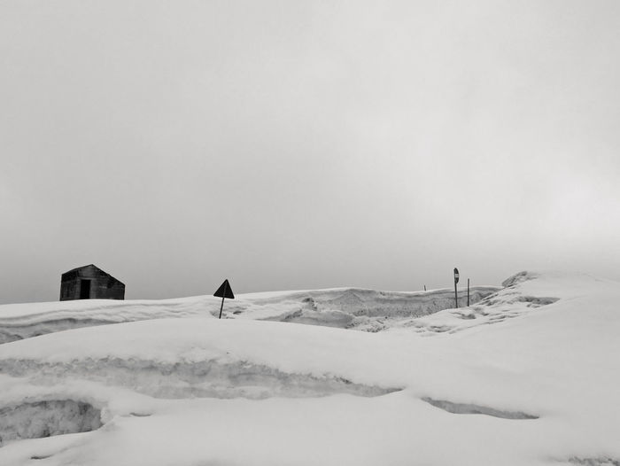 Scenic snowy mountain panorama on a leaden day