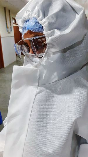 Close-up of doctor wearing protective workwear