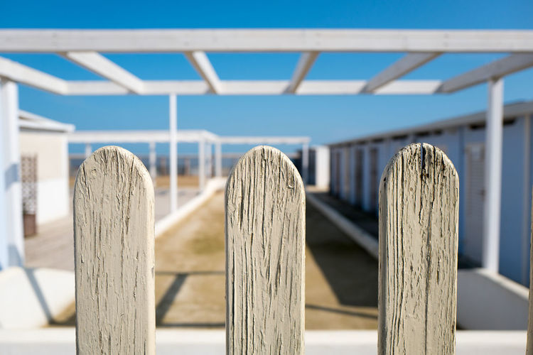 Close-up of picket fence on sunny day