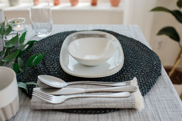 Place setting on a romantic dinner table for two