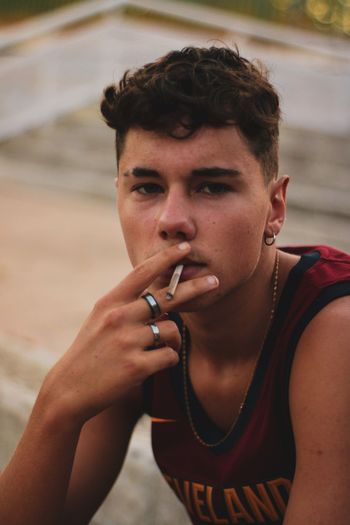 Portrait of young man smoking
