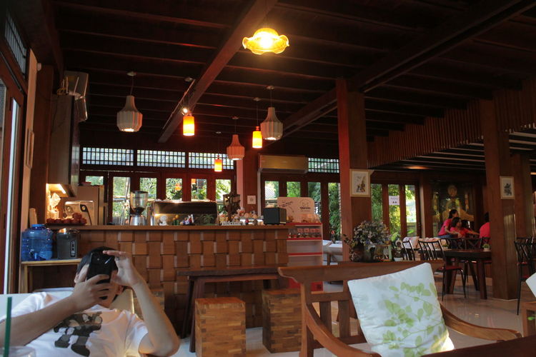 Man photographing in restaurant