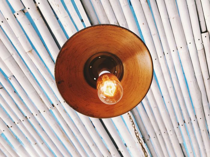Low angle view of pendant light hanging from ceiling