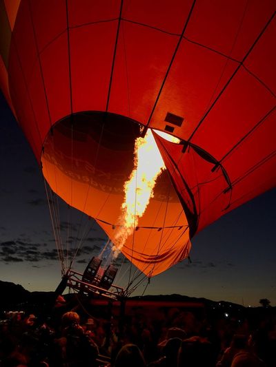 Illuminated hot air balloon against sky at night