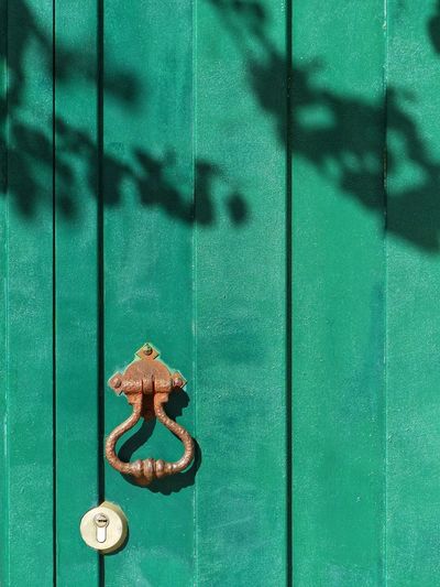 Close-up of green closed door