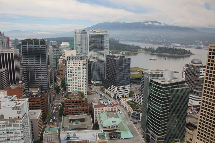 High angle view of buildings in city against sky