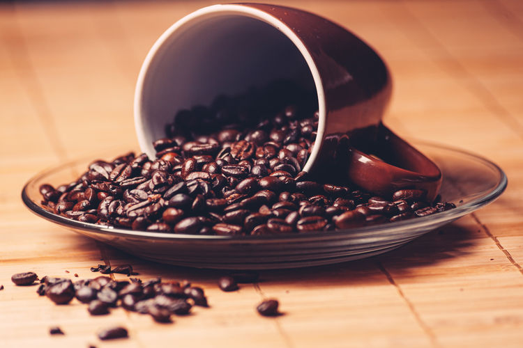 Close-up of coffee beans on table
