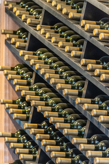 High angle view of wine bottles on rack