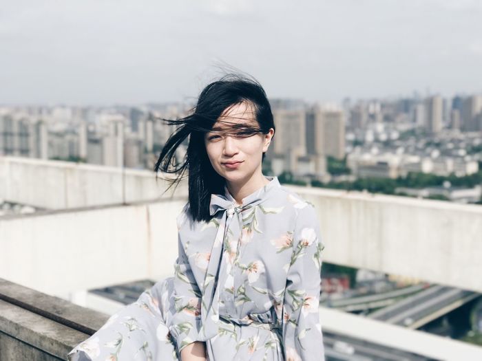 The Portraitist - 2017 EyeEm Awards Portrait Portrait Of A Woman One Person Black Hair Outdoors Focus On Foreground Leisure Activity Smiling Sitting High Angle View Looking At Camera