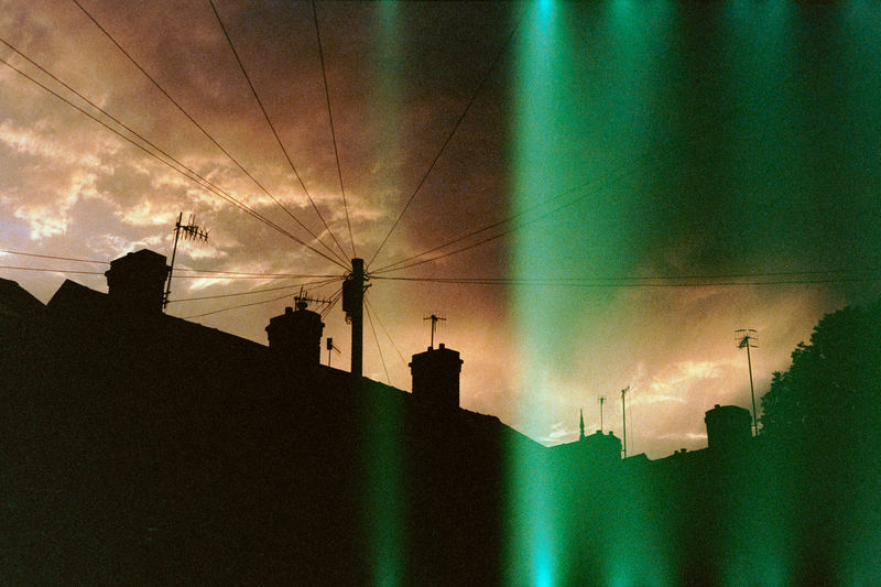 Low angle view of silhouette buildings against sky during sunset