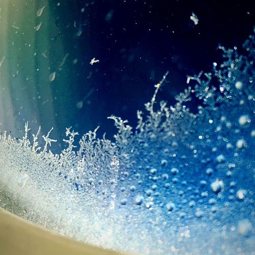 Close-up of water splashing on white background