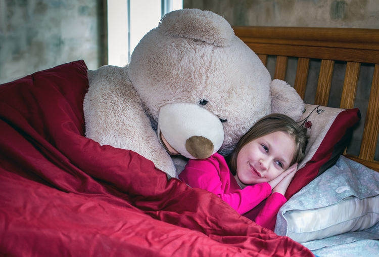 Big stuffed bear asks a little girl if she is awake or sleeping