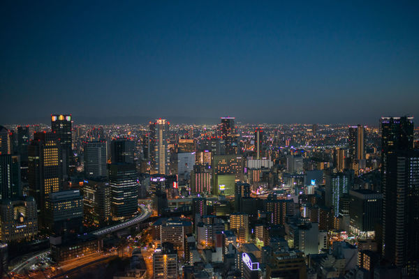 Aerial view of osaka by night. skyscrapers and the city in the distance. japan, asia