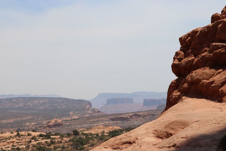 Rock formations at arches national park against sky