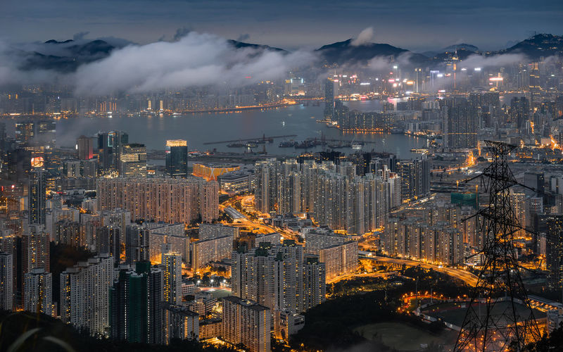 Aerial view of illuminated buildings in city at night