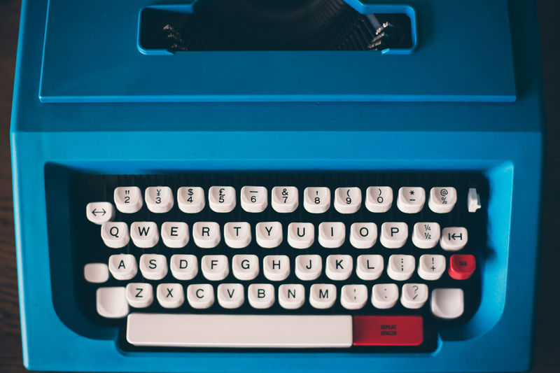 High angle view of blue typewriter