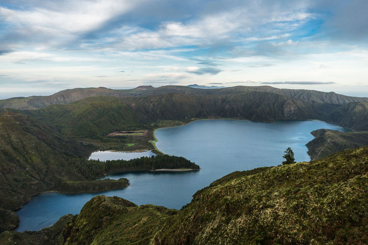 Lagoa do fogo lagoon surrounded by green forest located on sao miguel, azores, portugal.