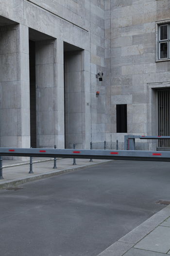 Roadblock barricades over street against building in city